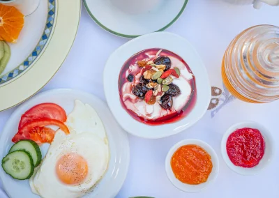 Greek yoghurt with fruit, fried egg and breakfast accompaniments