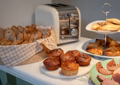 Fresh bread and sweet and savoury pastries on the breakfast buffet